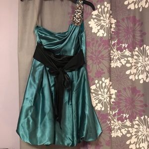 Formal dress with jeweled one strap.  Worn 1x